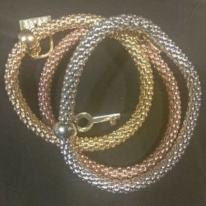 Tri color bracelet with charms